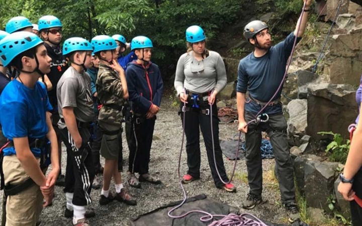 teens learn rock climbing skills in minnesota on outward bound course